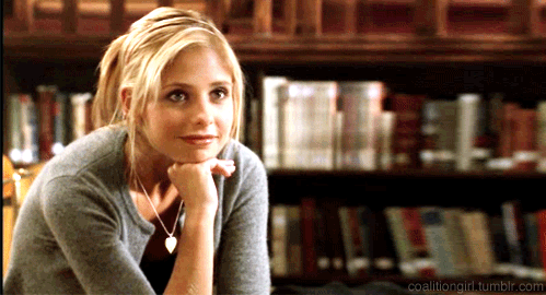 GIF of Buffy, raising her eyebrows while smiling.